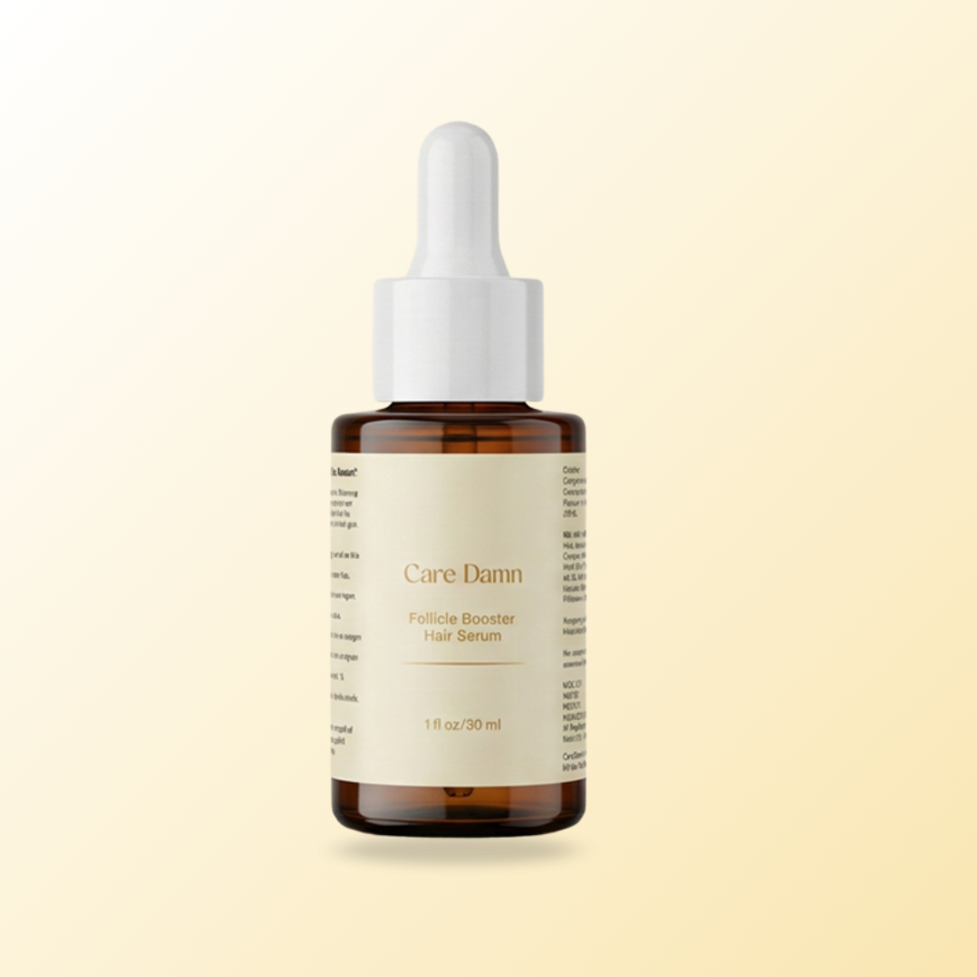 Bottle of Care Damn follicle booster hair serum on a beige background